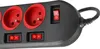 A close-up view of a black power strip with red outlets and switches. Náhled obrázku produktu