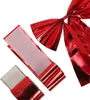 A red decorative bow with a Velcro fastener, shown against a white background. Náhled obrázku produktu