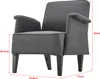 A dark gray upholstered armchair with wooden legs, shown from the side with dimensions indicated by red lines and text. Voir les images du produit