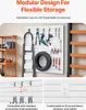 A garage wall with a modular storage system displaying various tools and a tire. Produktbild-Vorschau