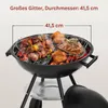 A close-up view of a charcoal grill with food cooking on it, with a measurement overlay indicating the grill's diameter. Produktbild-Vorschau