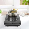 A pot of spaghetti is cooking on a portable induction cooktop on a kitchen counter. Produktbild-Vorschau