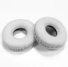 Two white ear pads for headphones are shown on a white background. Náhled obrázku produktu