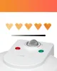 Close-up of a waffle maker with heart-shaped waffles displayed. Produktbild-Vorschau