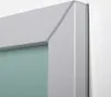 A close-up view of the corner of a mirror frame, showing the silver-colored metal frame and a hint of the mirrored glass. Anteprima dell’immagine prodotto