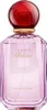 A perfume bottle with a red cap and pink liquid. Voir les images du produit