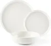 A set of white ceramic dishes, including a large plate, a smaller plate, and a bowl, arranged on a white background. Voir les images du produit