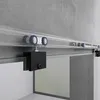 A close-up view of a sliding glass door system mounted on a wall. Produktbild-Vorschau