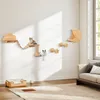 A living room scene with a cat climbing wall furniture, a sofa, and a rug. Náhľad obrázku produktu