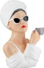 A bust of a woman wearing a white turban and sunglasses, holding a cup of coffee. Produktbild-Vorschau