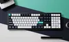 A top-down view of a mechanical keyboard on a multi-colored background. Produktbild-Vorschau