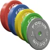 A set of five colored weightlifting plates arranged diagonally. Produktbild-Vorschau
