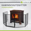 A black metal fireplace gate surrounds a brown wood-burning stove with a fire inside. Náhled obrázku produktu