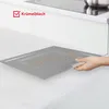 A hand is shown holding a crumb tray from a mini oven, with a checkmark and text indicating it's a feature. Produktbild-Vorschau