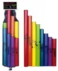 A set of colored tubes arranged in a descending order of height, with another set of the same tubes in a net bag. Náhled obrázku produktu