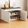 A shoe cabinet with a bench seat, displaying shoes on its shelves. Anteprima dell’immagine prodotto