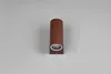 A single brown cylindrical wall light fixture is mounted on a light gray wall. Voir les images du produit