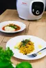 A Tefal Cook4me+ smart multi-function cooker is shown in the background, with two plates of food in the foreground. Podgląd zdjęcia produktu