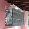A ceiling-mounted electric clothes dryer with two patterned fabrics hanging from it, in a room with pink walls and wooden beams. Náhľad obrázku produktu