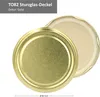 A close-up, top-down view of two golden jar lids, one slightly overlapping the other, against a white background. Text indicating product details is present in the upper left corner. Produktbild-Vorschau
