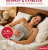 A woman is lying in bed holding a hot water bottle. Anteprima dell’immagine prodotto