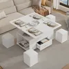 A white convertible coffee table with hidden stools and storage is set up in a living room next to a sectional sofa. Podgląd zdjęcia produktu
