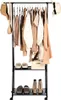 A black metal garment rack with clothes and accessories displayed on it. Anteprima dell’immagine prodotto