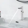 A modern silver faucet with an infrared sensor is dispensing water into a white sink. Produktbild-Vorschau