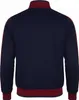 The back view of a navy blue training jacket with burgundy stripes on the sleeves and trim. Produktbild-Vorschau