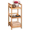 A three-tier bamboo shelving unit with various items on the shelves. Náhled obrázku produktu