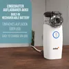 A white nebulizer with a charging cable plugged in, placed on a wooden surface next to a small plant. Produktbild-Vorschau