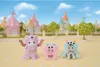 Three plush monster toys are displayed in front of a colorful, cartoonish castle background. Podgląd zdjęcia produktu