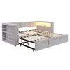 A light gray sofa bed with a pull-out section, a tufted headboard with LED lighting, and a side shelf unit. Voir les images du produit