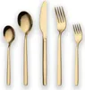 A set of gold-colored cutlery arranged in a row against a white background. Anteprima dell’immagine prodotto