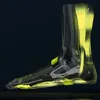 A 3D rendering of a foot and ankle, showing internal structures highlighted in yellow, with a hexagonal mesh overlay. Produktbild-Vorschau