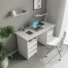 A white desk with a laptop, lamp, and chair in a room with gray walls and a plant. Produktbild-Vorschau