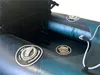 Close-up view of the interior of an inflatable kayak, showing two pressure valves and a rope. Podgląd zdjęcia produktu