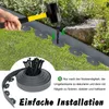 A hand is shown using a mallet to hammer a stake into a grey plastic lawn edging, with a roll of the edging and stakes in the foreground. Náhled obrázku produktu