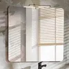 A bathroom vanity set with a mirror, double sink, and cabinets, set against a floral wallpaper. Produktbild-Vorschau