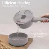A hand is pouring water from a pot into a bowl, demonstrating an efficient pouring feature. Náhled obrázku produktu