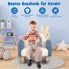 A young child is sitting on a blue and white rocking chair in a room with toys and decorations. Anteprima dell’immagine prodotto