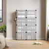 A modular storage unit filled with folded clothes and shoes, placed in a room with a window and a bed. Produktbild-Vorschau