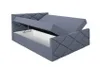 A grey upholstered bed frame with the storage compartment open, showing the inside. Produktbild-Vorschau