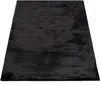 A black rug is shown from a slightly elevated angle against a white background. Produktbild-Vorschau