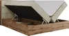 A boxspring bed with its mattress lifted to reveal the storage compartment underneath. Produktbild-Vorschau