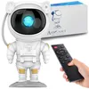An astronaut-shaped night light projector with a remote control and its packaging. Anteprima dell’immagine prodotto
