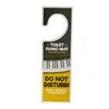 A door hanger with a piano keyboard design and text. Anteprima dell’immagine prodotto