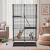 Three cats are playing in a multi-level cat cage in a living room. Náhled obrázku produktu