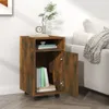 A wooden cabinet with an open door, placed next to a sofa with a blanket draped over it. Náhľad obrázku produktu