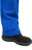 A close-up view of a person's leg wearing blue pants with a cuffed hem and a black shoe. Produktbild-Vorschau